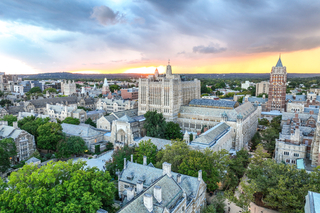 Sprawling aerial view of Central Campus's gothic architecture at sunset